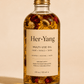 Her•Yang Rose Multi-Use Glow Oil bottle with dropper, featuring a rose design and clear glass packaging.