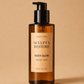 HerYang Sculpt x Restore™ Body Glow Body Oil in a clear glass bottle with a pump dispenser, showcasing a golden-colored oil.