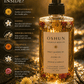 Her•Yang Oshun Honey Body Oil bottle with golden liquid, smooth texture, and elegant packaging visible in the image.