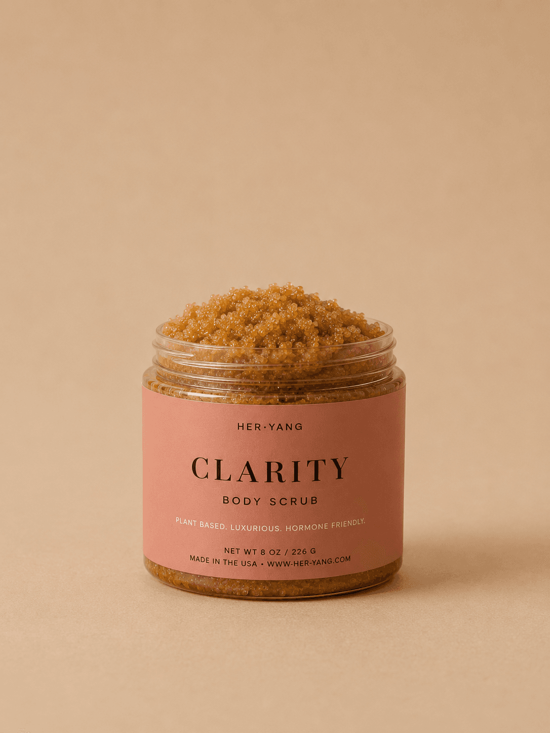 HerYang Clarity™ Body Acne Scrub showing the exfoliating texture with natural ingredients on a white background.