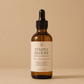 HerYang Temple Bloom™ Hairline & Edge Elixir hair oil bottle with dropper in a clear container, designed for hairline and edges.