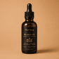 HerYang Rooted™ Beard Growth Oil bottle showing the dark glass container with a black dropper cap and product label.