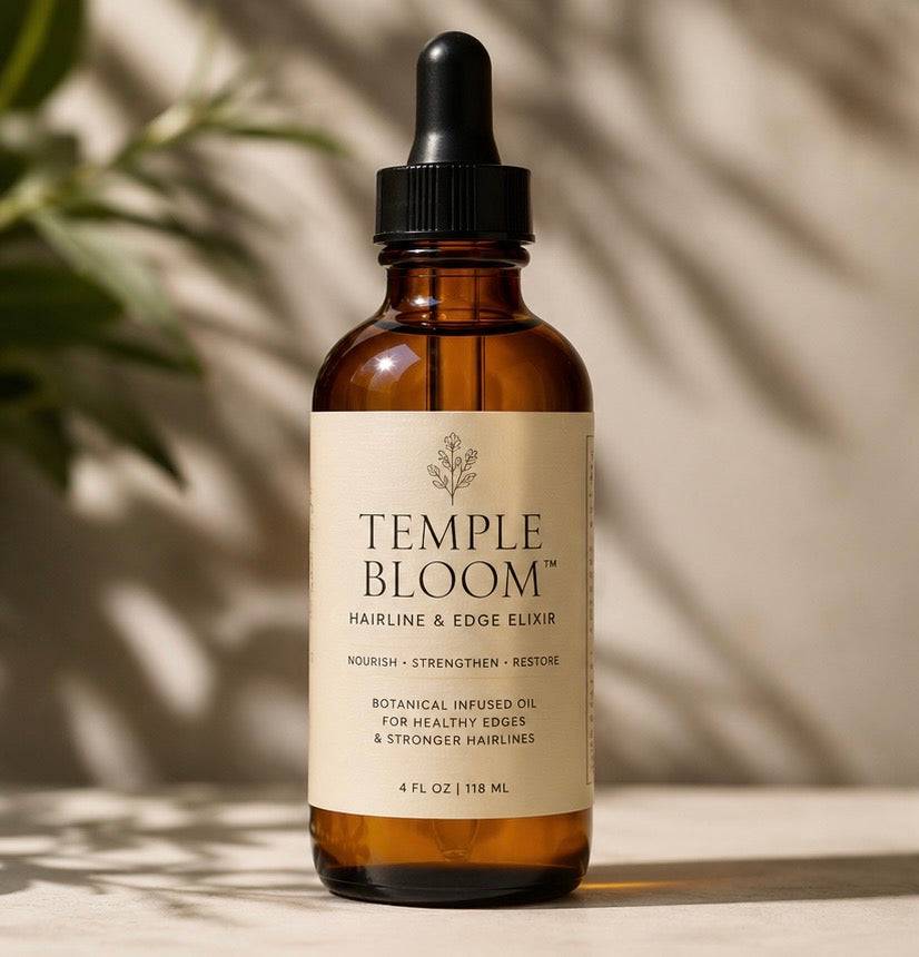 Her•Yang Temple Bloom™ Hairline & Edge Elixir hair oil bottle with dropper, designed to nourish hairlines and edges.