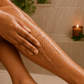 Her•Yang Clarity™ Body Acne Scrub in a jar, showing the textured exfoliating body scrub with a natural appearance.