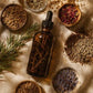 Her•Yang Temple Bloom™ Hairline & Edge Elixir hair oil bottle with dropper, designed for hairline and edge care.