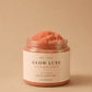 HerYang Glow Luxe Sugar Body Scrub in 8 oz jar, featuring exfoliating sugar and hydrating ingredients for smooth skin.